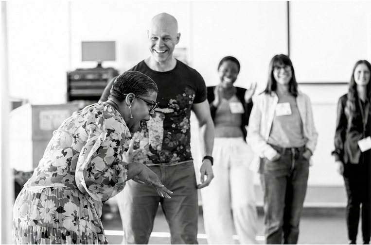 A moment of play between participants in a Theater of Self workshop